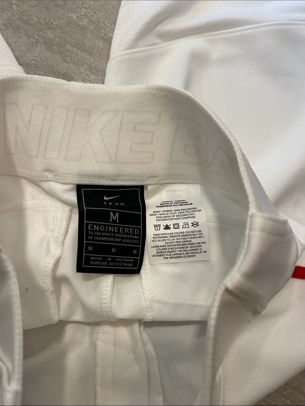 Nike White Baseball Pants with Red Swoosh Accent